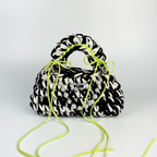 Handmade crochet handbag in black and white with a bag charm by Studio YUK