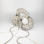Handmade crochet handbag in white and grey with a bag charm by Studio YUK