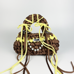 Handmade crochet handbag in brown and yellow with a bag charm by Studio YUK