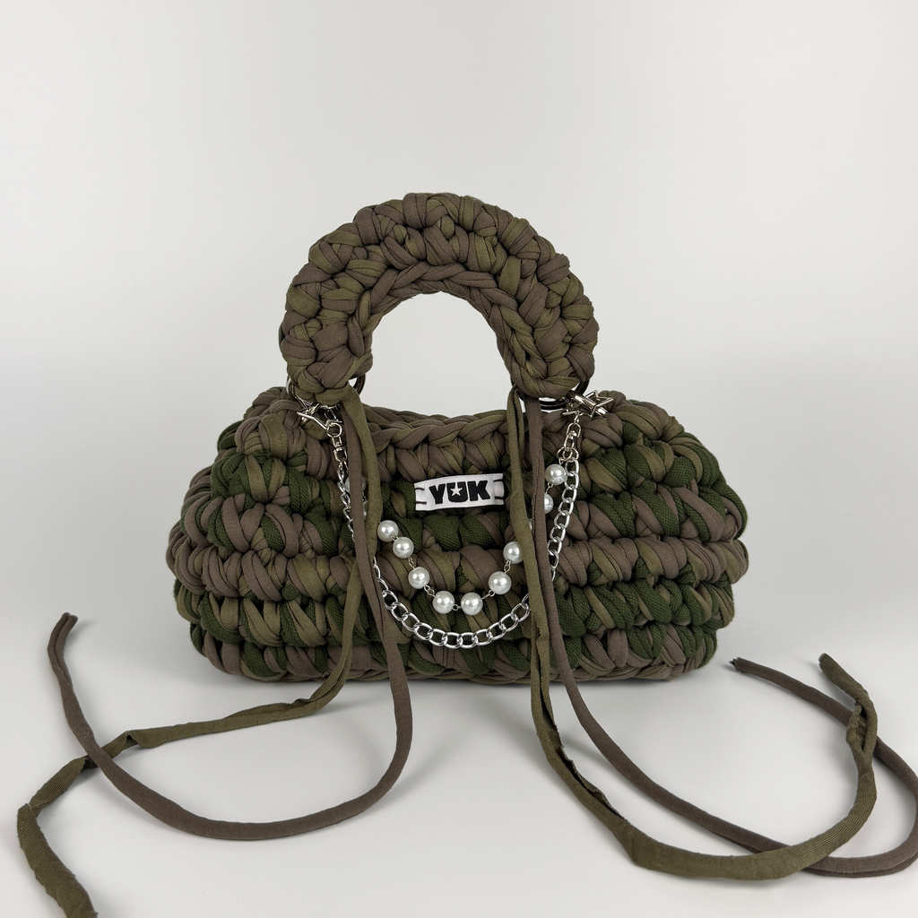 Handmade crochet handbag in a green and taupe mix with a bag charm by Studio YUK
