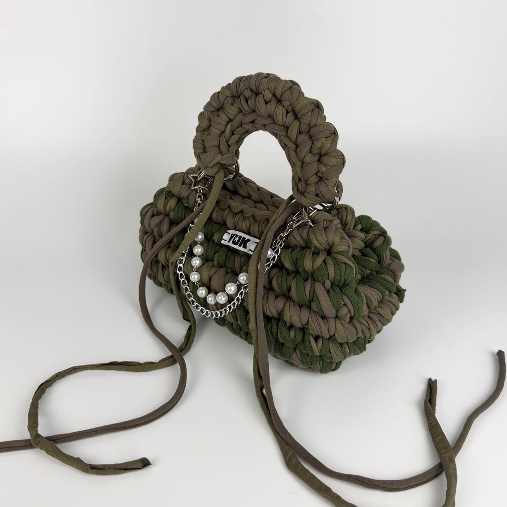 Handmade crochet handbag in a green and taupe mix with a bag charm by Studio YUK