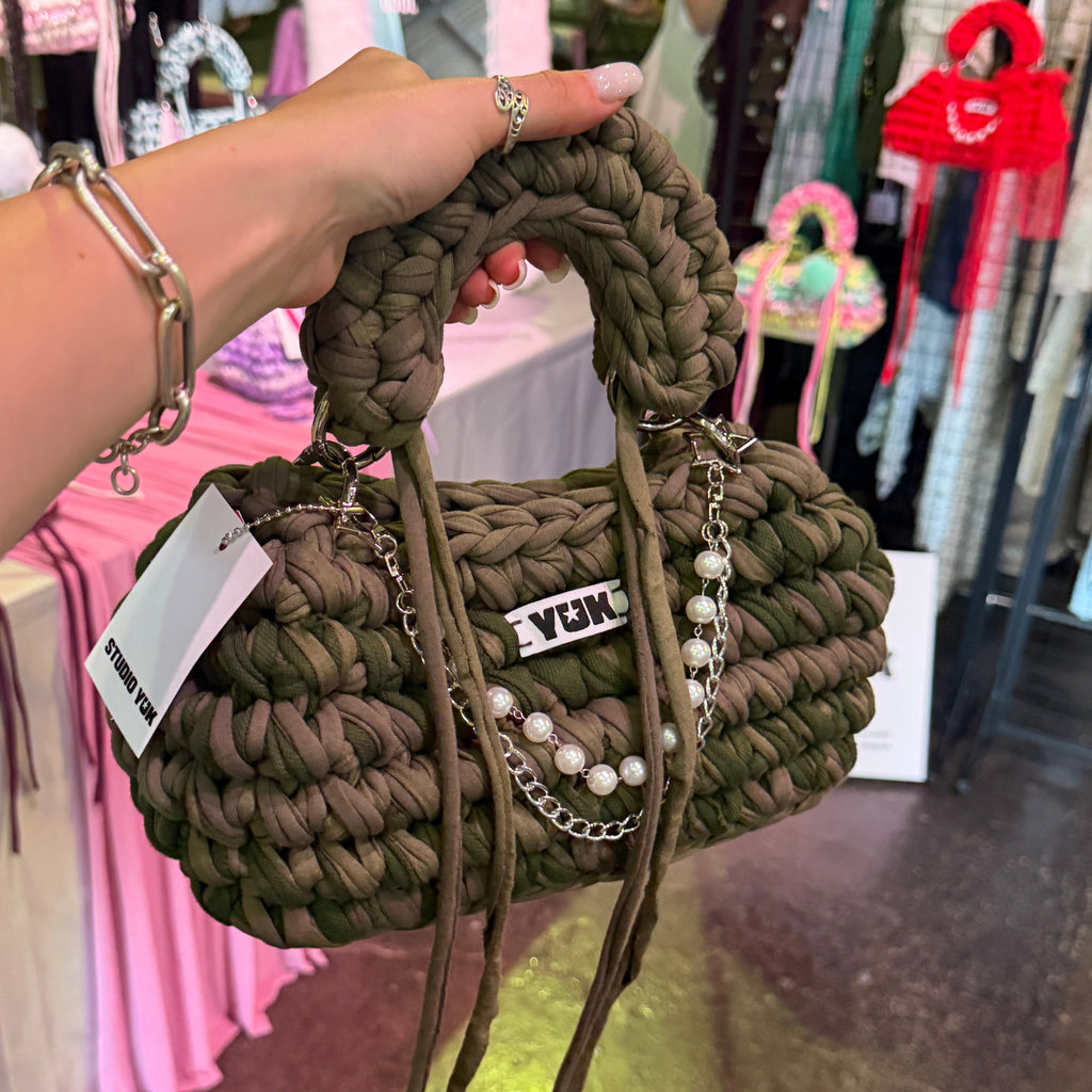 Handmade crochet handbag in a green and taupe mix with a bag charm by Studio YUK