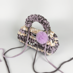 Handmade crochet handbag in lilac, purple, grey, white and beige with a bag charm by Studio YUK