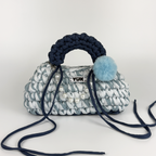 Handmade crochet handbag in a blue mix and a bag charm by Studio YUK