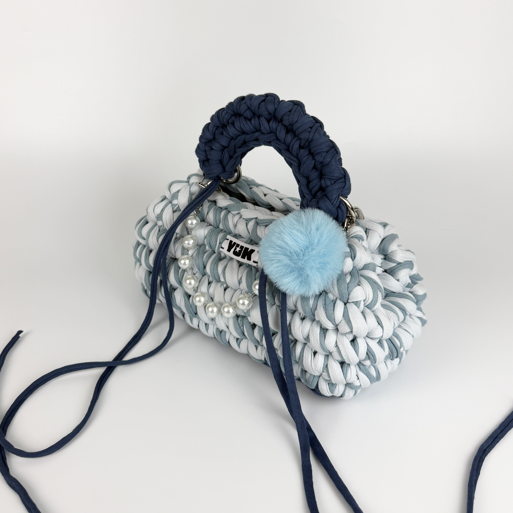 Handmade crochet handbag in a blue mix and a bag charm by Studio YUK