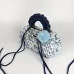 Handmade crochet handbag in a blue mix and a bag charm by Studio YUK