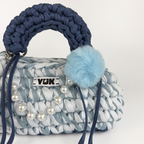 Handmade crochet handbag in a blue mix and a bag charm by Studio YUK