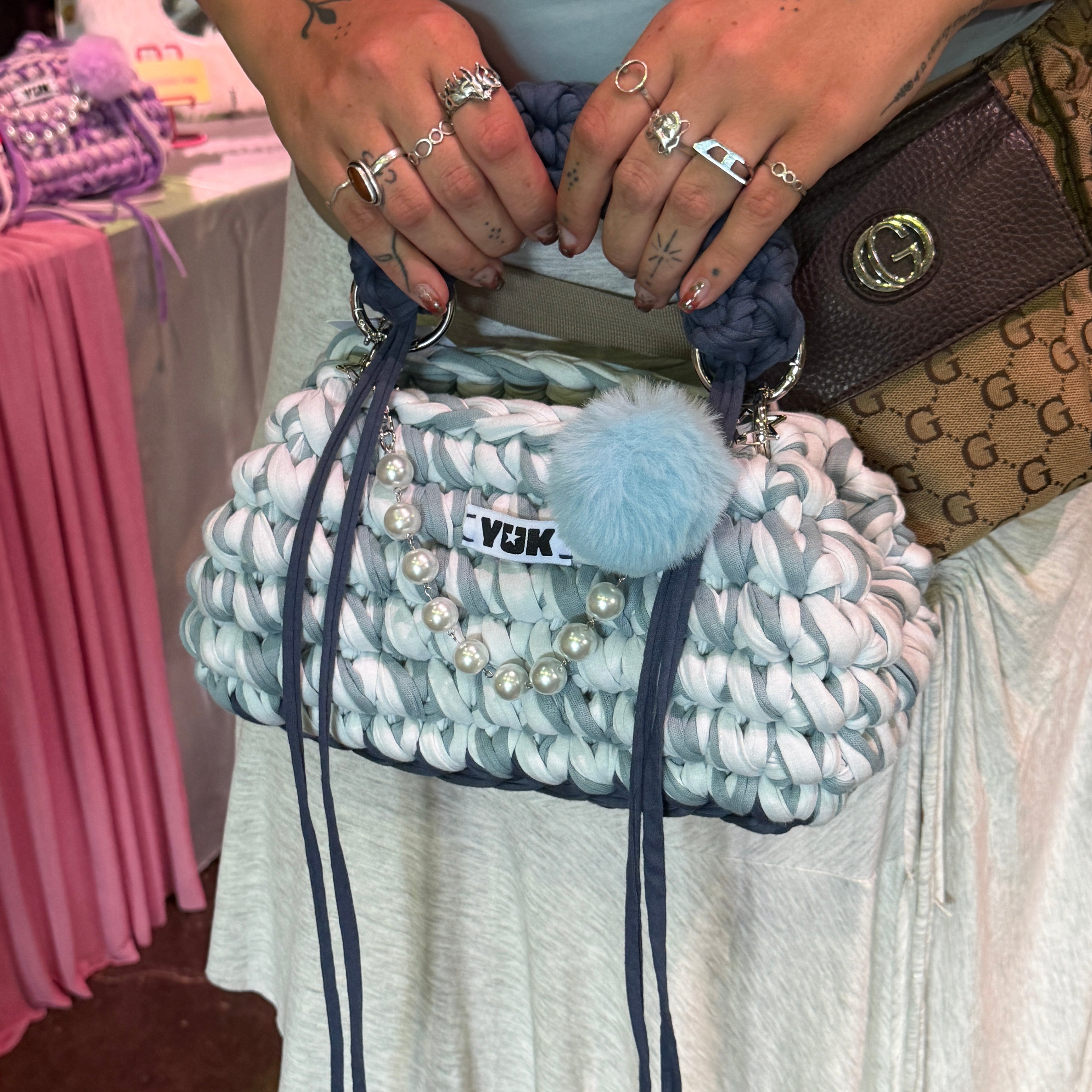 Handmade crochet handbag in a blue mix and a bag charm by Studio YUK