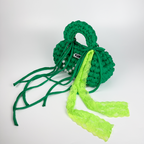 Handmade crochet handbag in green with lace detail and a bag charm by Studio YUK