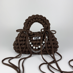 Handmade crochet handbag in brown with a bag charm by Studio YUK