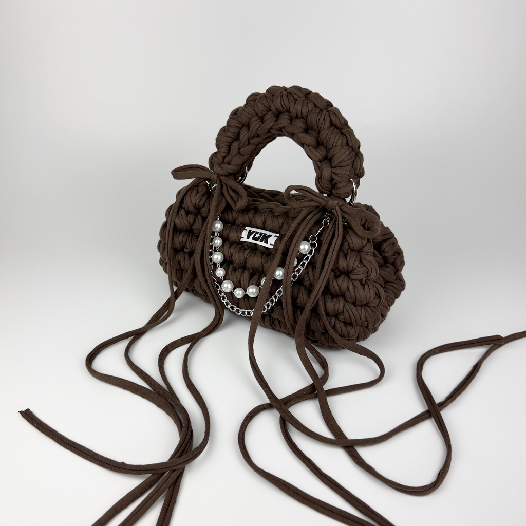 Handmade crochet handbag in brown with a bag charm by Studio YUK
