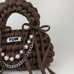 Handmade crochet handbag in brown with a bag charm by Studio YUK