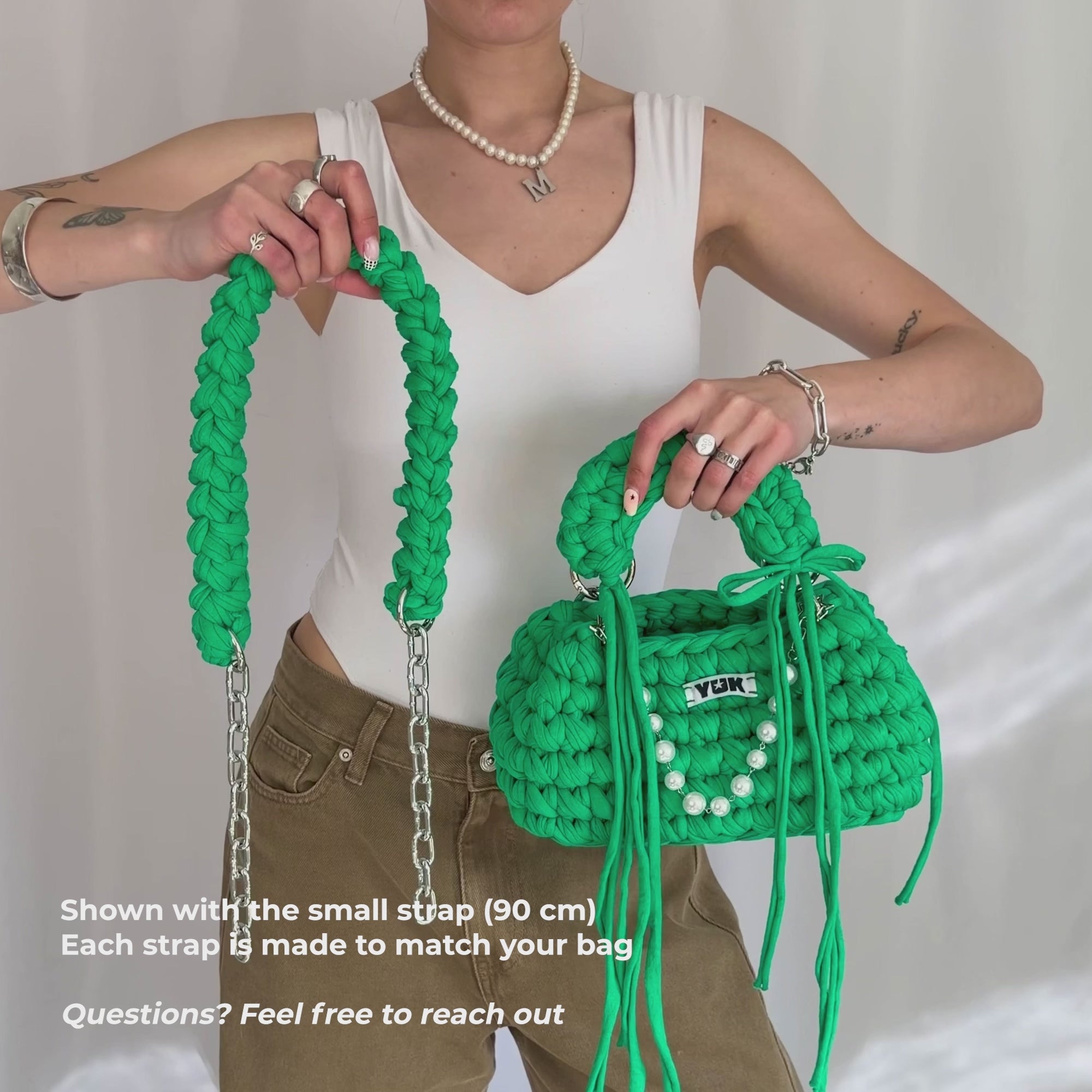 Video showing a detachable made-to-order crossbody strap attached to a Studio YUK crochet bag